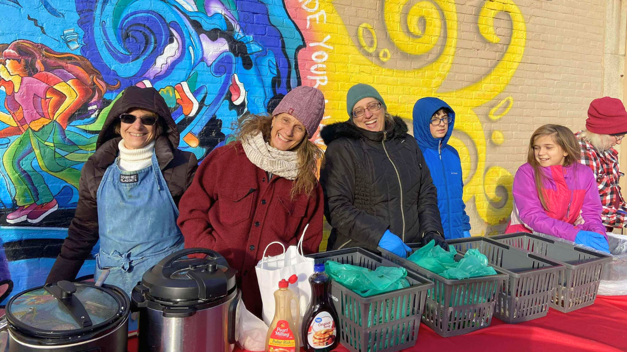 Volunteers serving meals